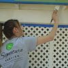 esler companies gives back with rebuilding day in las vegas - employee painting a home